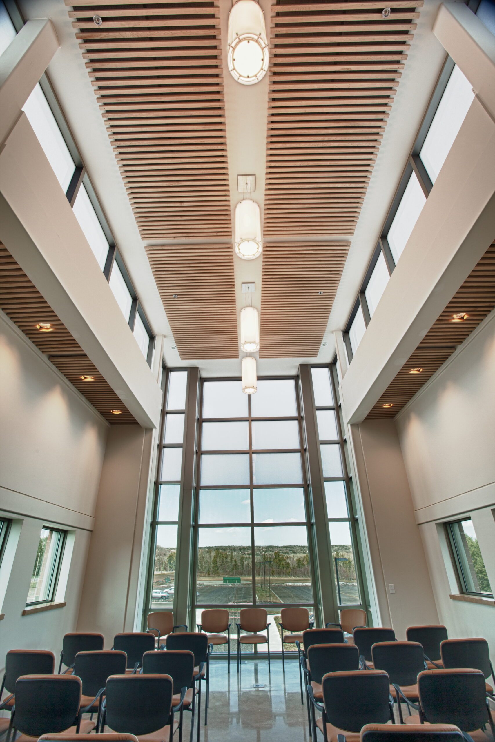 Crandall University interior with tall windows and timber ceiling